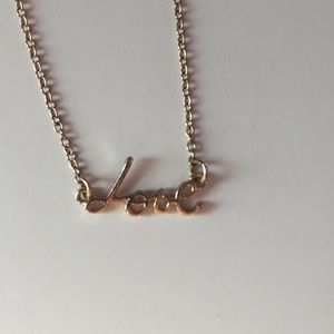 Gold “Love” necklace
